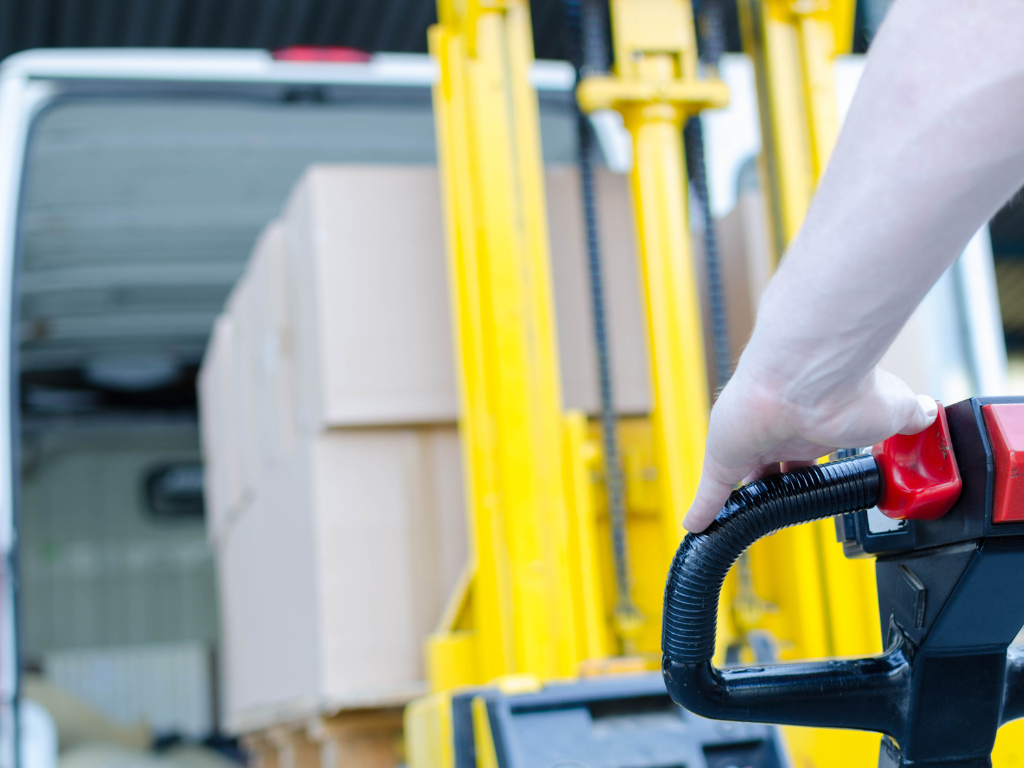 forklift loading stock in van at sellgoods warehouse in tipton
